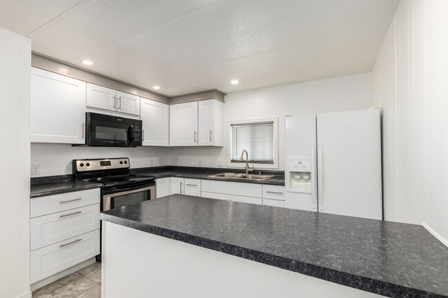 Building Photo - Remodeled 2-Bedroom, 2-Bath Home in Gated ...