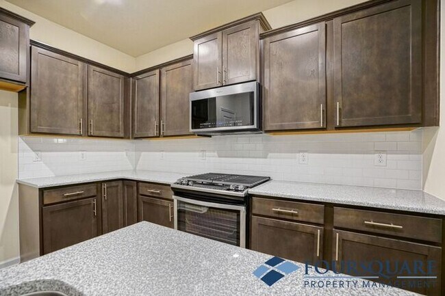 Building Photo - Spacious 3-Bed End- Unit Townhome with Mod...