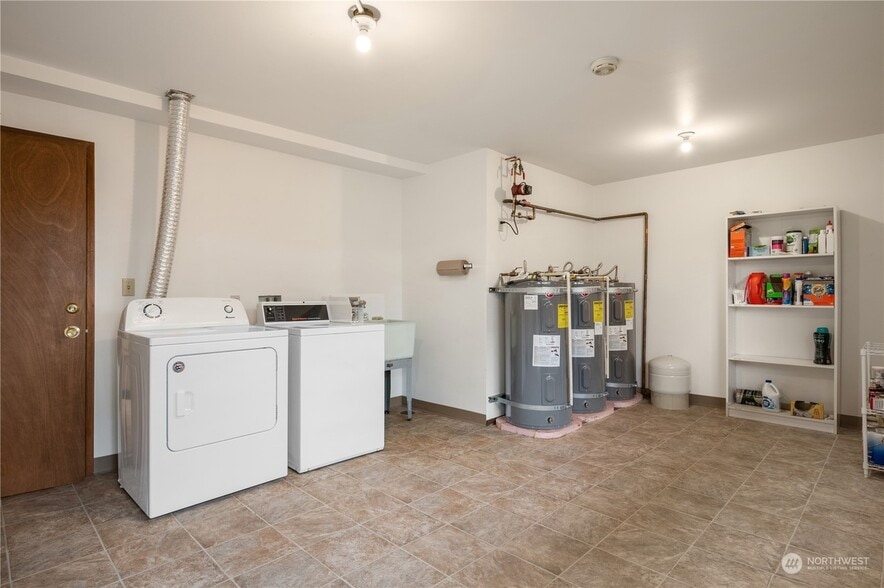 The building includes a spacious shared laundry room that's accessible directly from this unit. - 3033 21st Ave W