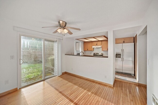 Building Photo - AVAILABLE NOW! 2BR/2BA Condo – Awesome Location! Glossy Hardwoods, Granite Countertops, W/S/G Inc...