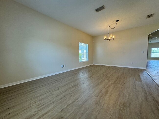 Building Photo - Beautiful 3/2 home near Lake Nona ~ Fenced In Yard ~ LVP & Tile Flooring ~ Community Pool!