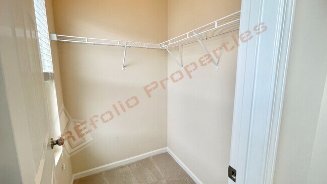 Building Photo - 3 Story Townhome 3 Bedrooms Rear Entry 2 Car Attached Garage with 1st Floor Bedroom, Community Po...