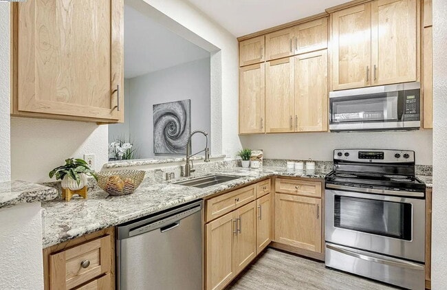 Building Photo - Beautiful & spacious 1 bedroom  updated condo with private patio and covered parking.