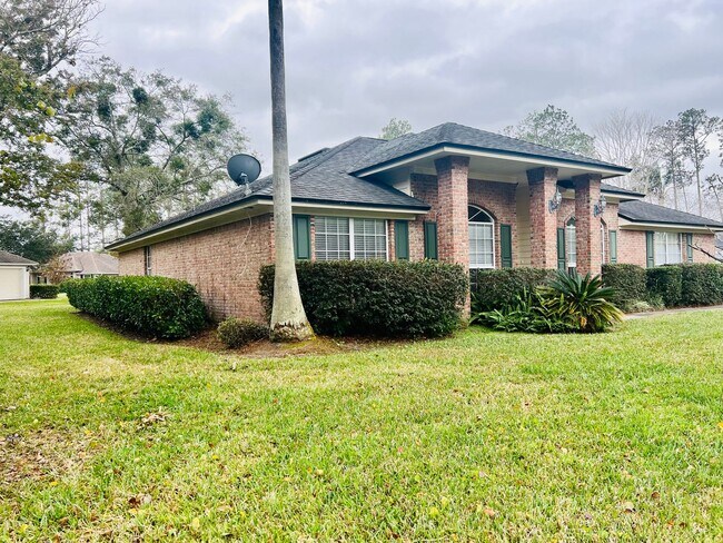 Building Photo - Behind the Gates: A Corner-Lot 4 bedroom, 2 bath Retreat in Coveted Pace Island!!