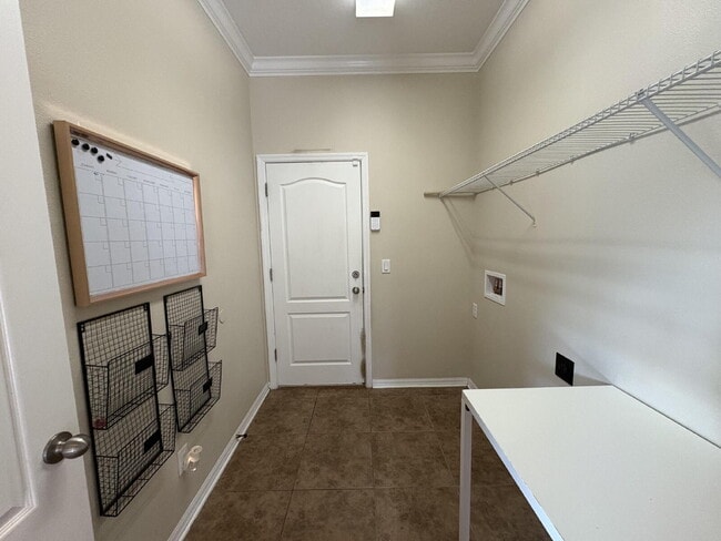 Building Photo - Spacious 5-Bedroom Pool Home with Putting ...