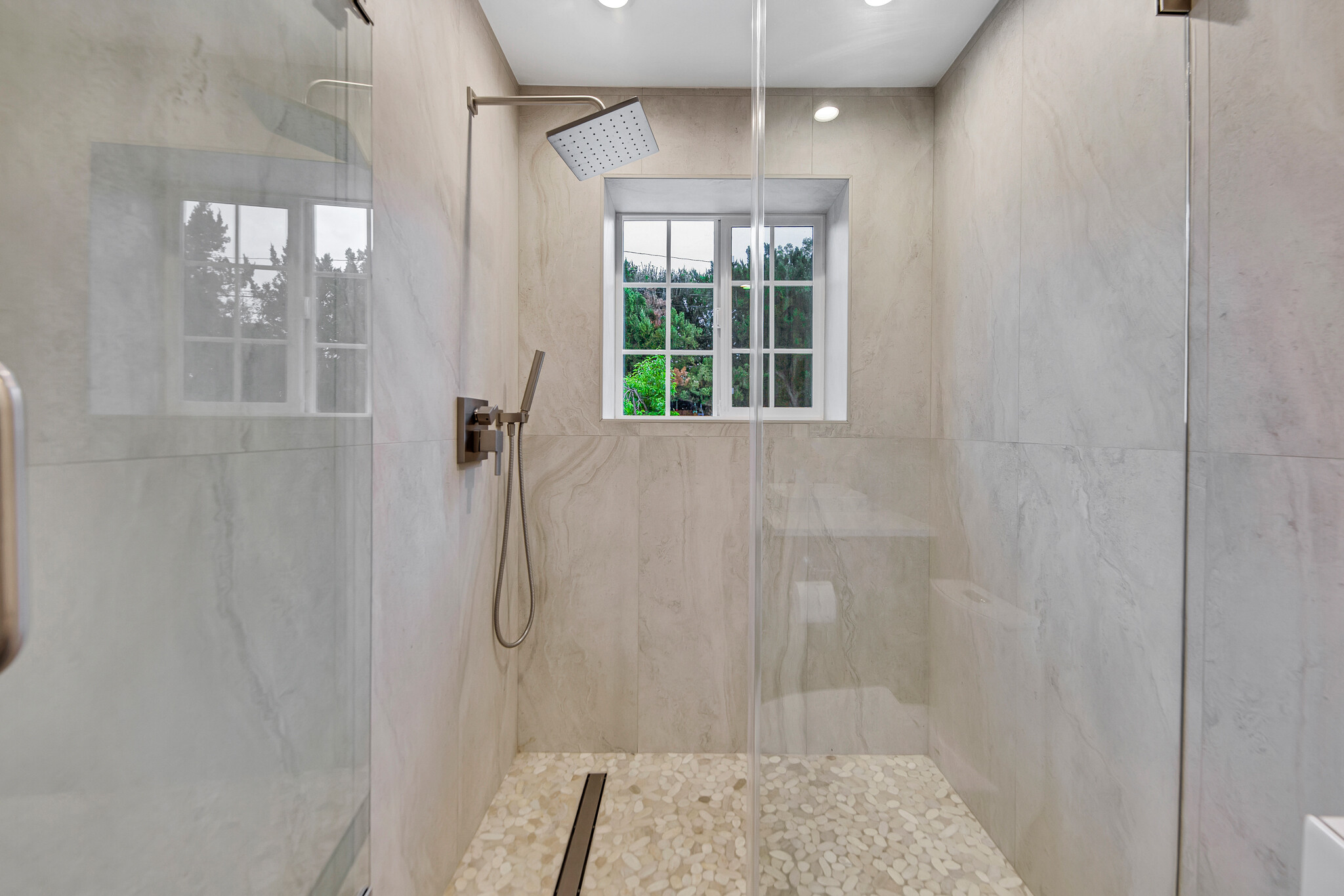Rain features & backyard views! - 6908 Royer Ave