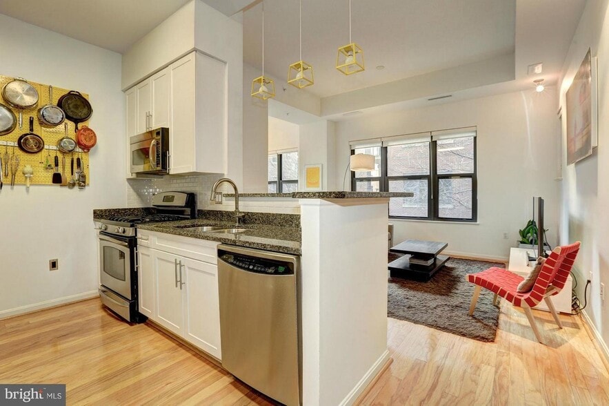 view of living room from kitchen with appliances. - 1390 Kenyon Street NW