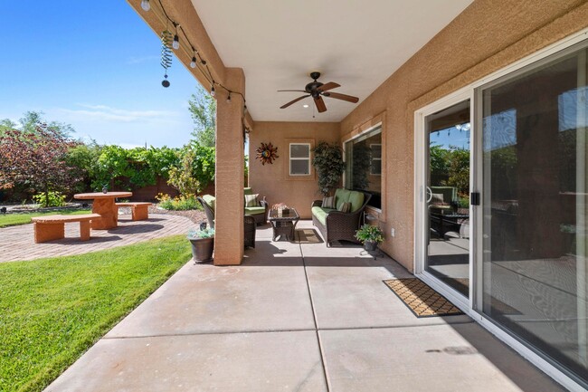 Covered patio with fans and adjustable shades - 1806 N Dixie Downs Rd