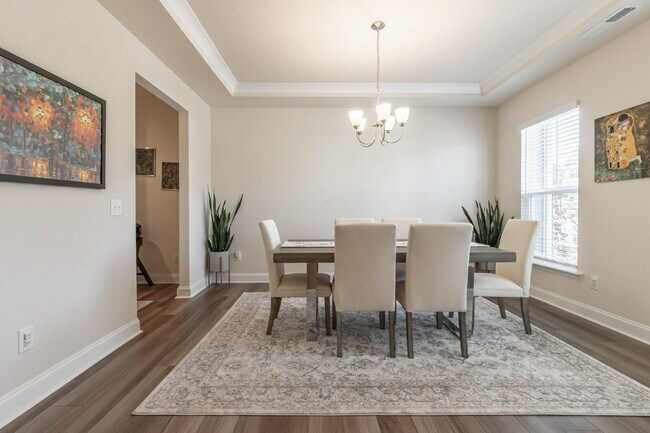 Building Photo - "Discover Spacious Living: 5-Bedroom Craftsman Home in Gated and Amenity-Rich Bretagne with Top-R...