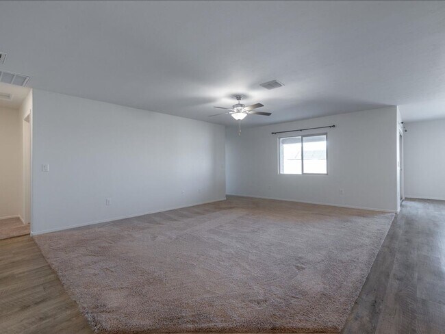 Building Photo - Spacious 4-Bedroom Home with Open Layout & Turf Backyard