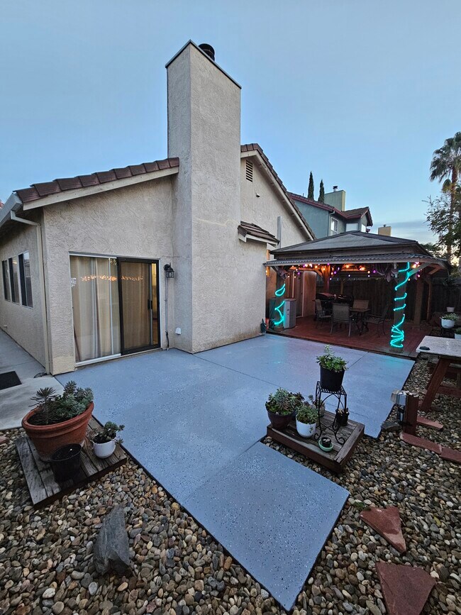 Outdoor Patio with brand new floor, beautiful pots of plants & garden host - 9316 Caulfield Dr