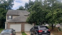 Building Photo - Charming 2Br 2.5Ba Townhome with Garage in...