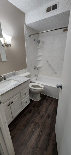 bathroom with marble vanity - 1100 E 6th St