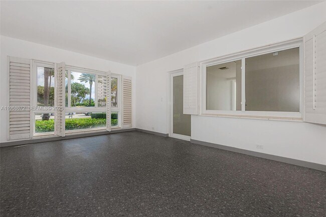 Building Photo - 9920 Collins Ave