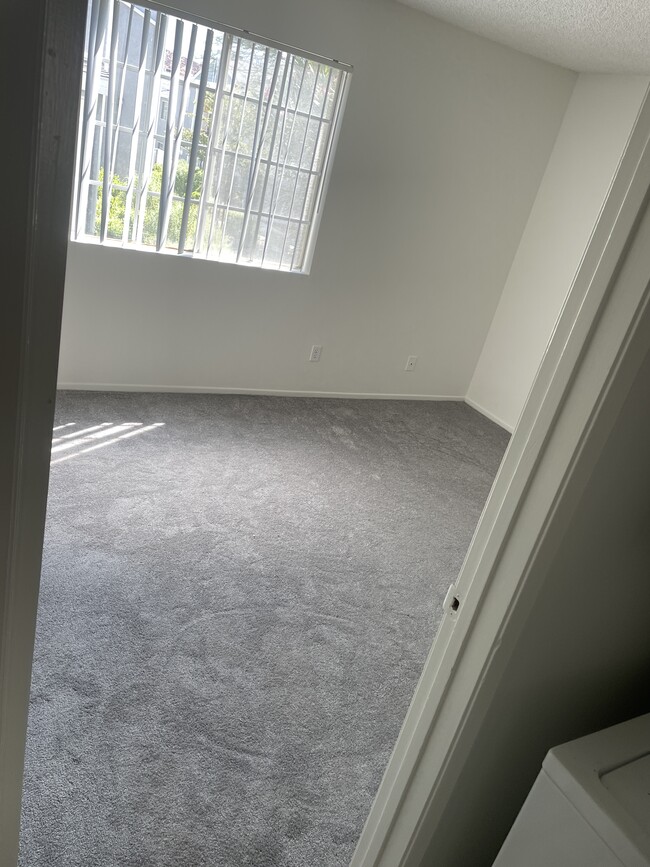 Guest bedroom with new carpet and window for lots or light - 18071 Beneda Ln