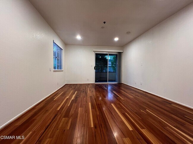 Building Photo - Welcome to this beautifully situated first-floor end unit