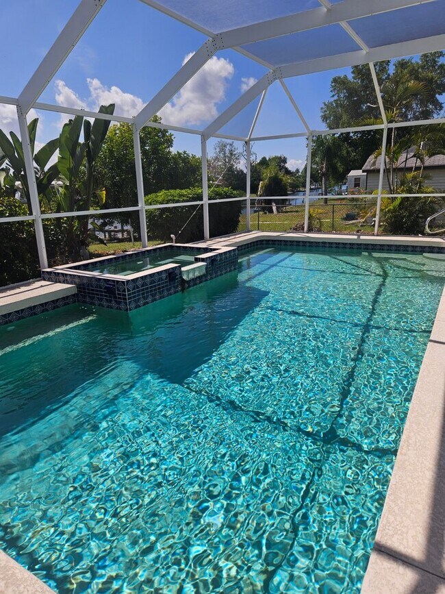Building Photo - Port Charlotte Waterfront salt water pool annual rental