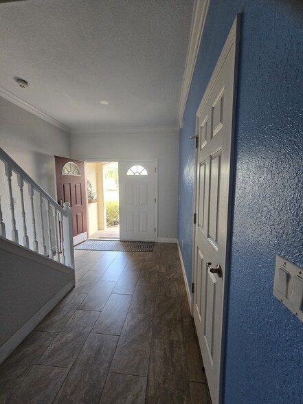 Foyer / Garage door (on right) - 802 King Neptune Ln