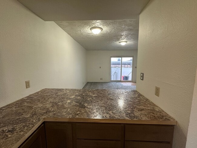 Building Photo - Spacious, three level, 4 Bed 2.5 bath Townhome in Ammon right behind the Walmart on Hitt.