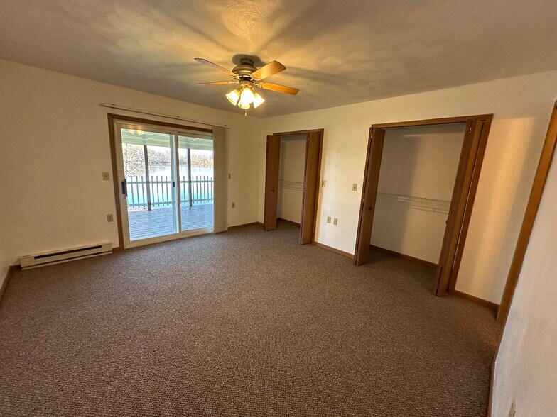 Primary bedroom with double closets and covered deck - 1010 Lakeshore Dr