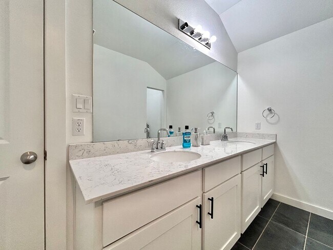 Building Photo - Inviting 4-Bed, 2.5-Bath Home with High Ceilings and Covered Deck