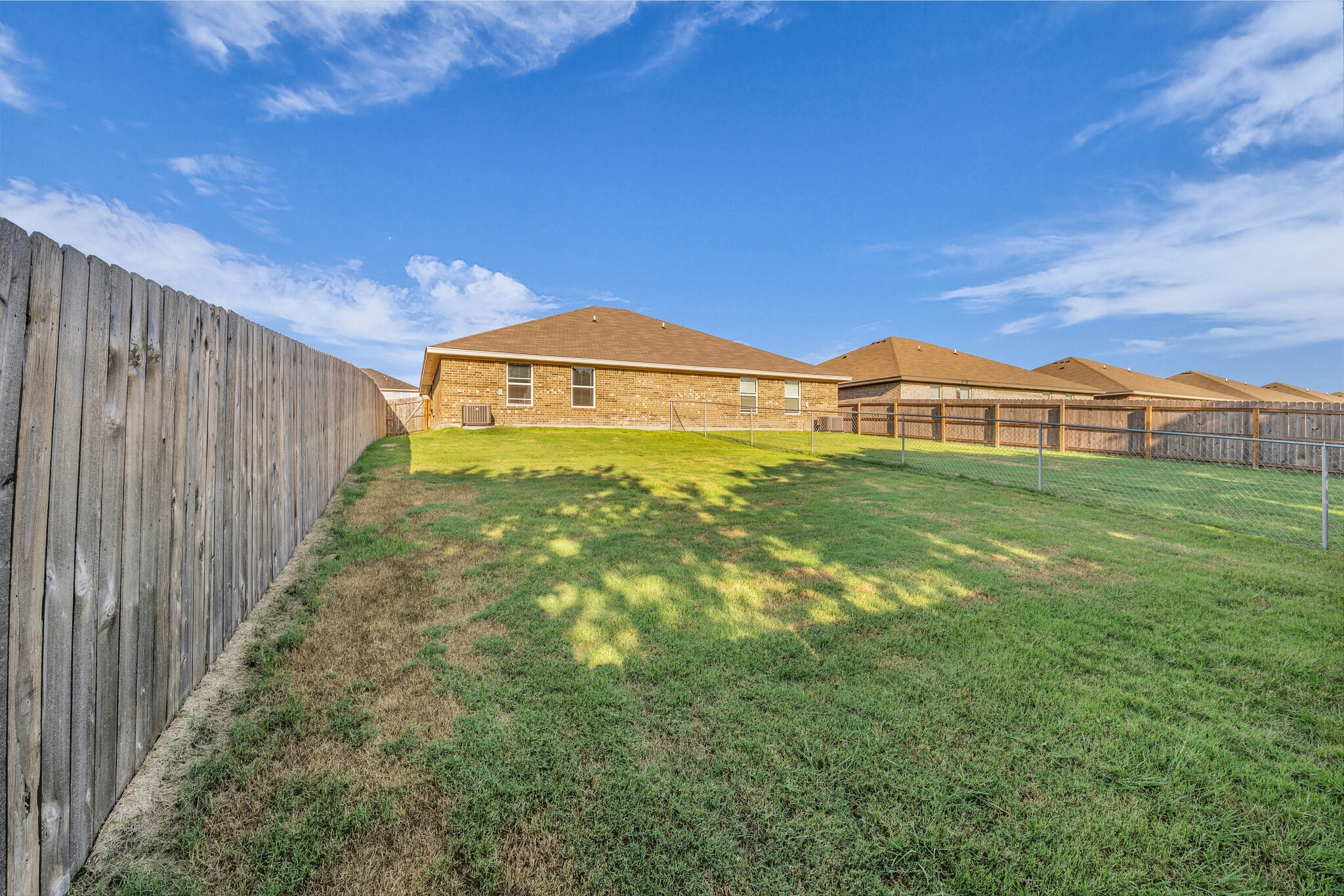 Large, fully fenced backyard - 609 Lost Trl