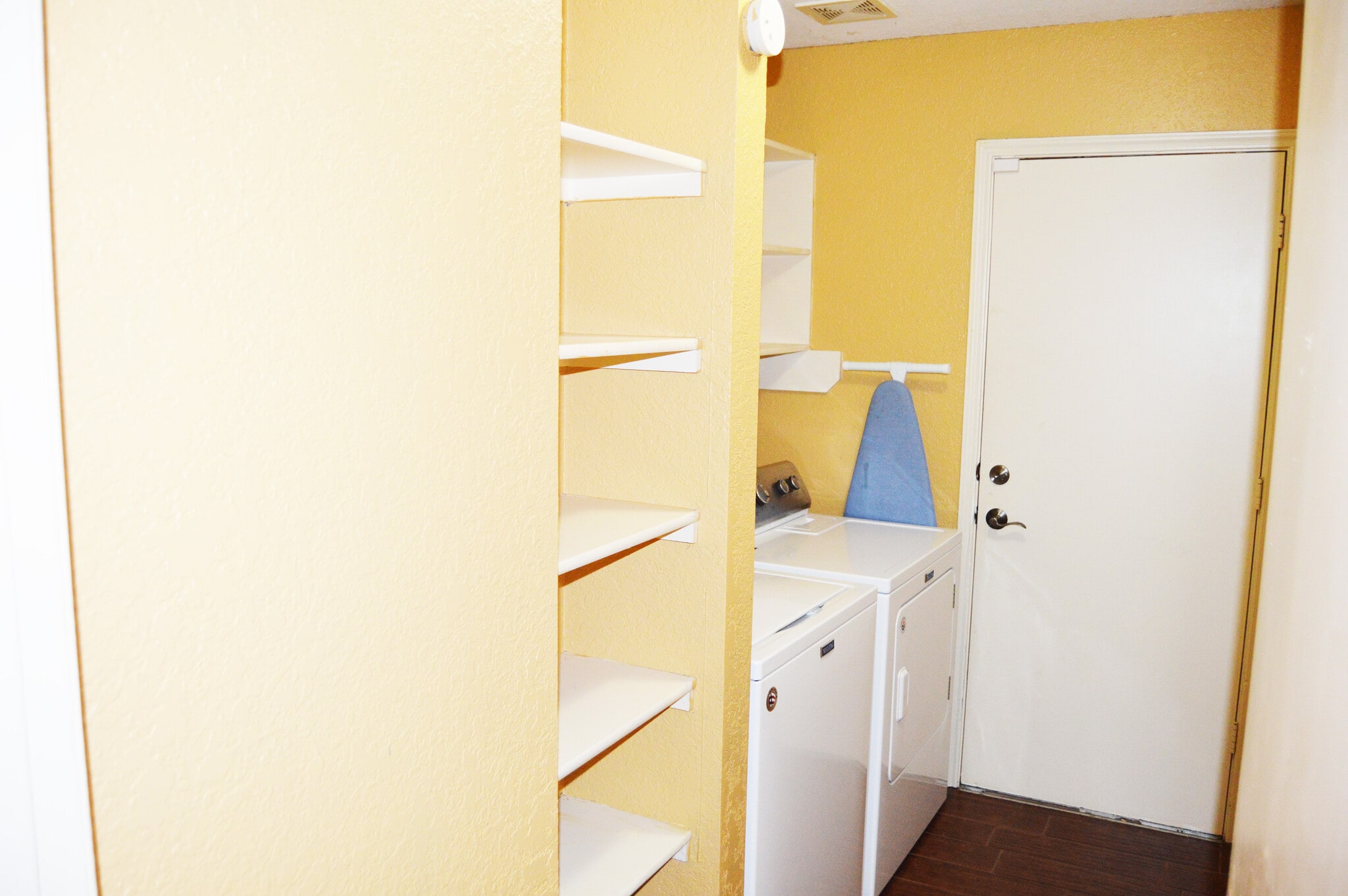 Laundry room has good storage with washer and dryer; ironing board included! - 23035 S Waterlily Dr