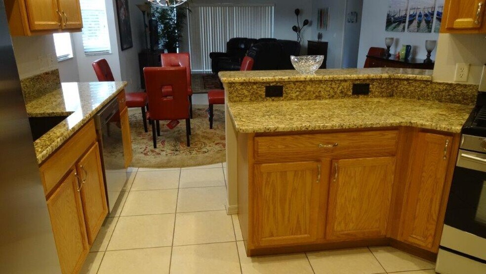 new granite and all pull out shelving in bottom kitchen cabinets. - 979 West Skyview Crossing Drive