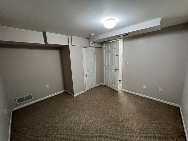 Building Photo - Steps from Kansas State University! Spacious 4-Bedroom Duplex