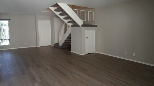 Building Photo - Two Story 4 BR 2.5 BA Condo With 2 Car Garage