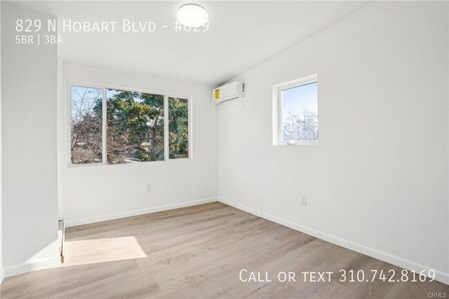 Building Photo - Luxe Living at 825 N. Hobart Blvd. – Where...