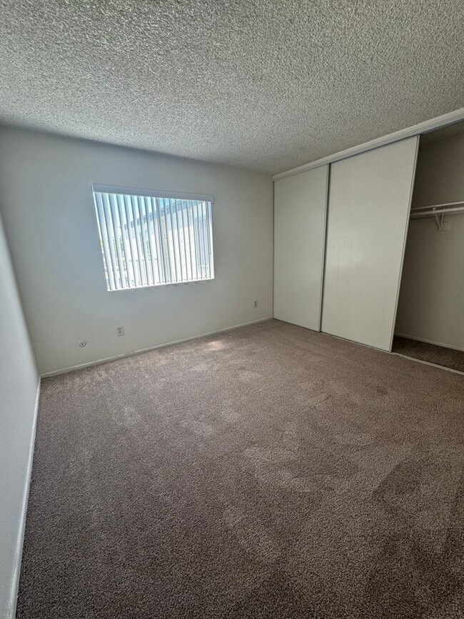 Building Photo - Upstairs two-bedroom 1/12 bath condo avail...