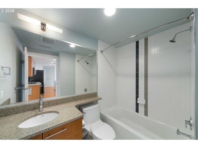 Building Photo - Modern 2-Bed/2-Bath Condo with Balcony & Prime Downtown Location