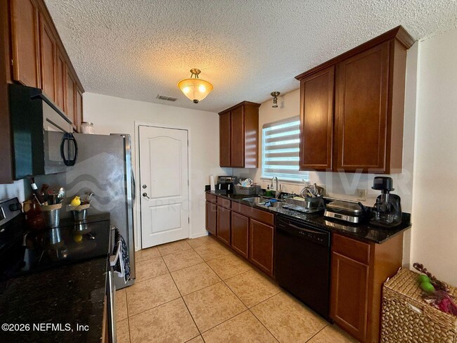 Building Photo - 7541 Allspice Cir N