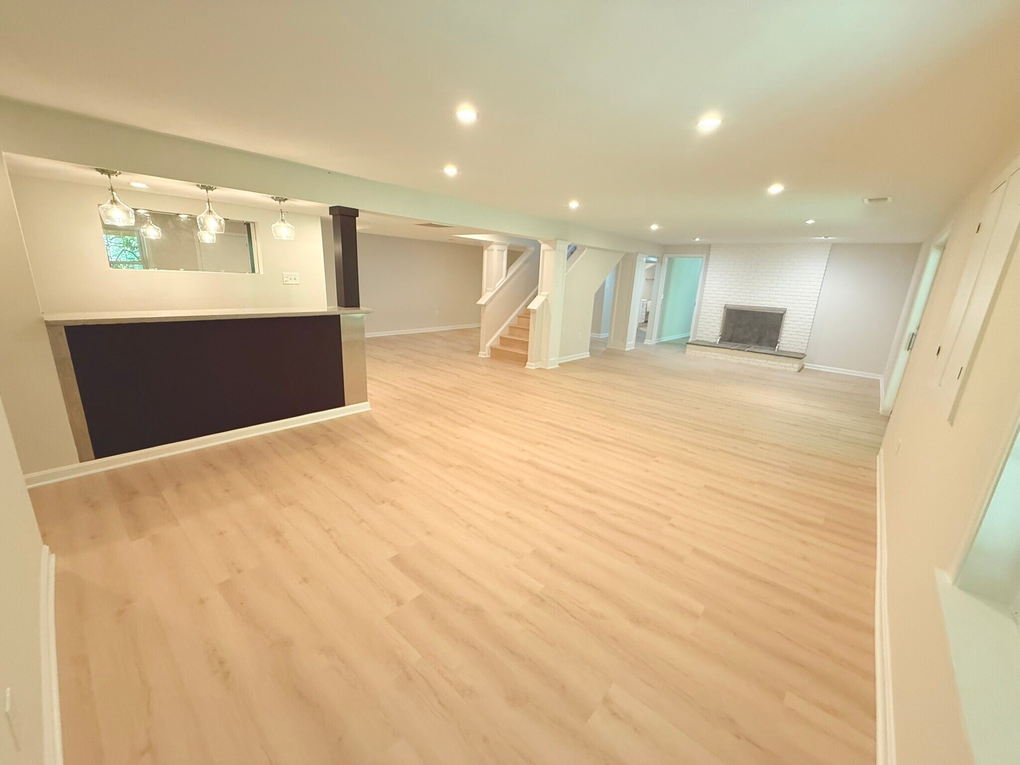 Basement rec room with two large spaces, a bar, and two bedrooms and full baths - 9248 Wood Glade Dr