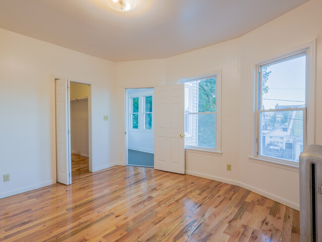 Primary bedroom with walk-in closet - 68 Llewellyn Ave