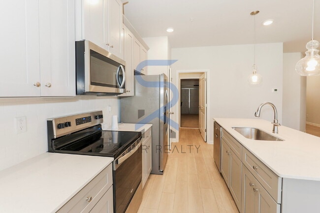 Building Photo - Move in before February 28th and choose your reward: a $250 Amazon Gift Card or a 55" Smart TV!