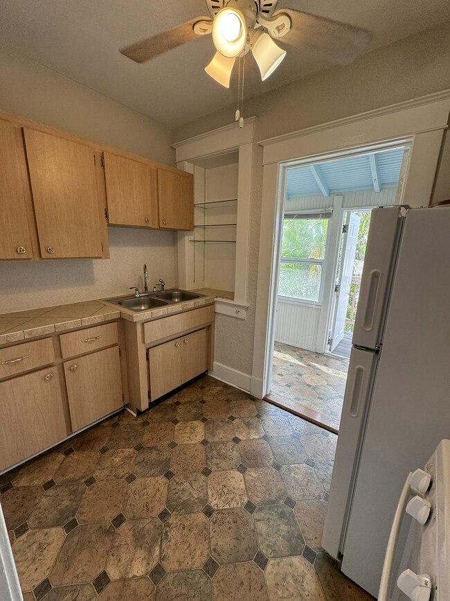 kitchen leads to rear bonus and outdoor balcony - 816 2nd St N