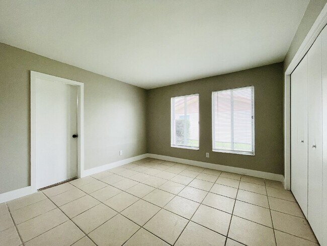 Building Photo - Updated 2-bedroom waterfront duplex with walk-in closets, enclosed Florida room, and canal views ...