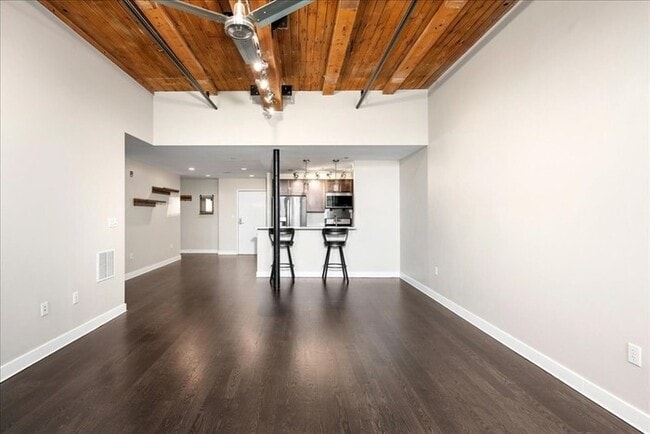 Building Photo - Stylish Industrial Loft with Exposed Brick, High Ceilings & Modern Kitchen