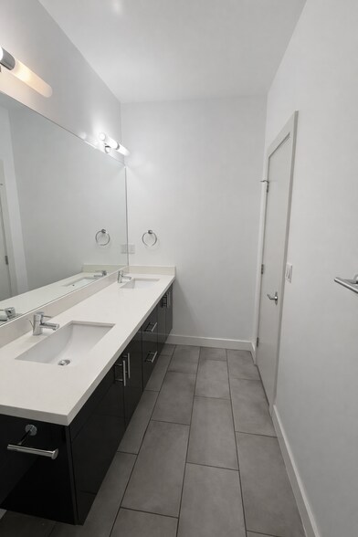 Spa-like primary bathroom with dual vanity - 1733 NW 63rd St