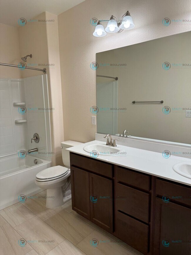 Building Photo - Luxury and Convenience Fully Equipped 3-Bedroom 2.5 Bathroom 2 Car Garage Townhome in Carson City