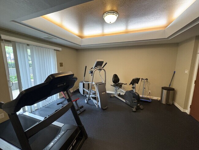 Building Photo - Bright, Modern 1BR Near Hospitals, SU & Transit in secure building with garage parking and a Walk...