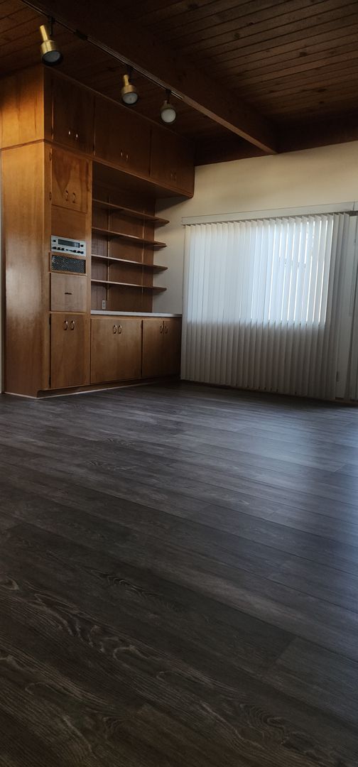 Building Photo - This is a spacious house featuring four bedrooms and two bathrooms, along with a two-car garage.