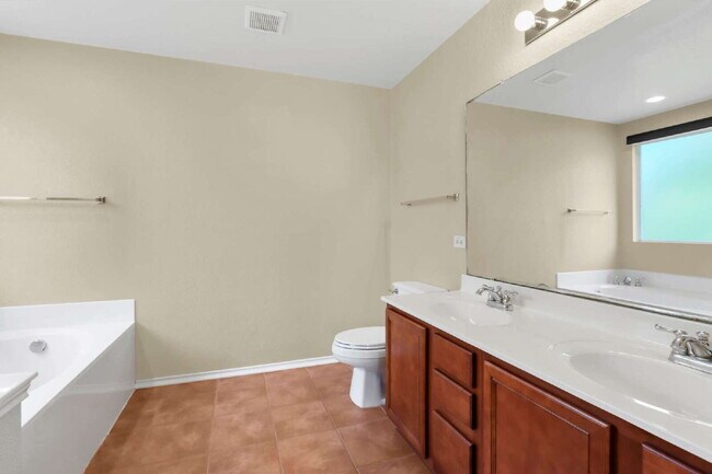 Building Photo - "2 WEEKS FREE! Spacious 4-Bedroom Sanctuary with 3 Full Baths and Solar Panels!"