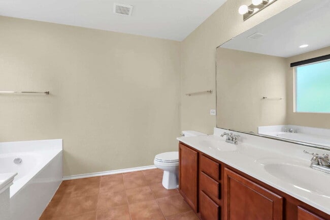 Building Photo - "Spacious 4-Bedroom Sanctuary with 3 Full ...