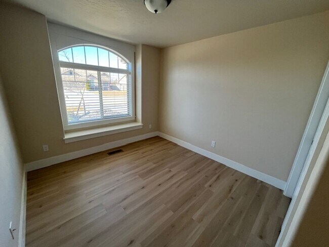 Building Photo - THREE-CAR GARAGE! This charming home offers 3 bedrooms, plus an office/rec room, and 2 bathrooms.