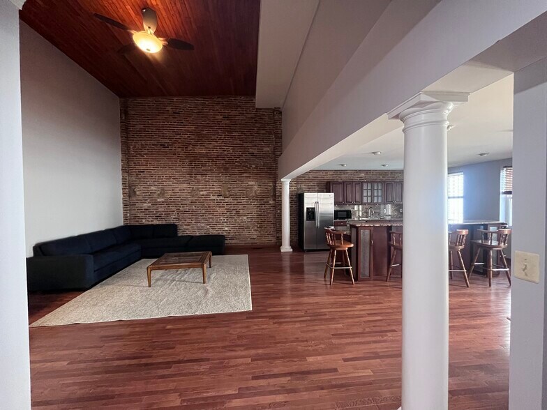 Kitchen Looks out to Living Room, third bedroom off to side - 409 S Spring St