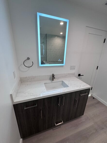 Bathroom vanity with lighted mirror - 2408 Highland Ave