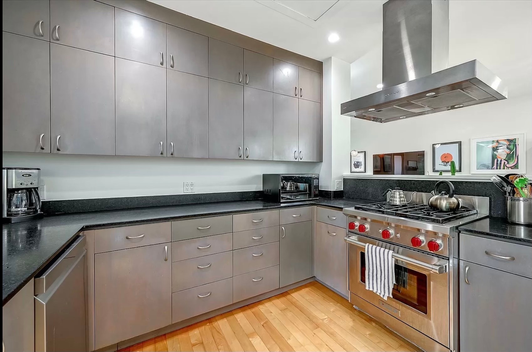 Large open kitchen with plenty of cabinets, Wolf gas range, dishwasher, & microwave - 328 Harriet St
